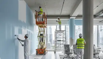 Commercial painting crew in Fort Lauderdale, FL applying durable exterior coatings to a business property